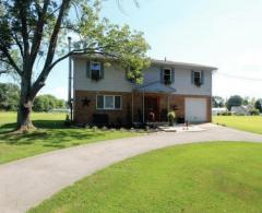 Fantastic home Situated on 1.3 acres with circular driveway! Enjoy a good book or morning coffee, on your large patio in the backyard, with beautiful mature trees surrounding. It's like being on vacation every day in your own home! You can enjoy swimming, boating, fishing, and hanging out on the beach, just steps from your front door! This is a Must see!