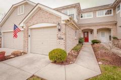 Welcome Home! Beautiful 3 bed/3.5 bath condo with finished basement and stunning wooded views