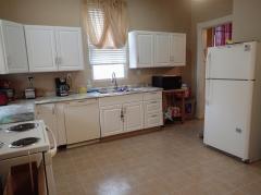 Another view of the Kitchen with a walk-out to the rear fenced yard.