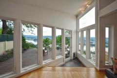 Grand views over the Ohio River and Northern KY. Lined with casement windows that hinge open, what a great space to call your own. Light a fire on a chilly evening and enjoy the sun and views during the spring and summer.