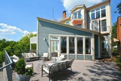 Back view of 1116 Carney street. Enormous tiered deck overlooking the mighty Ohio. The entire home has a sophisticated stylish vibe with angled walls, floor to ceiling windows, wine cellar, stainless steel appliances, quartz, counters, and an enormous tiered deck overlooking the mighty Ohio.