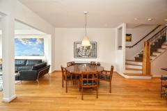 Opens in the center of the first floor to the dining room space. Hardwood floors are throughout the first floor. Other finished include recessed lighting, a two story entryway, and light streaming in from floor to ceiling windows.