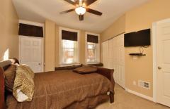 The lower Level Master Bedroom has its own entrance plus loads of closet space. Wall to wall carpet adds warmth to the room while two large windows offers views of the backyard.