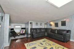 On the third floor is the bonus room with a bar area, skylight and walkout to the rooftop deck.