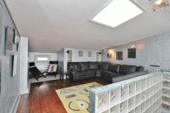 Watch a game of football or basketball this year in the sizable bonus room.
