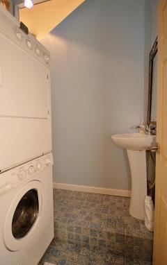The first floor powder room with pedestal sink will serve the main floor well. The laundry room is also in this area.