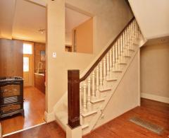 A charming staircase filled with character leads to the second floor.