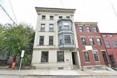 Two historic buildings were combined as one and share a common elevator to access the upper floors. Facing Alumni Lofts in the heart of the residential Pendleton neighborhood.