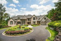 NEW PRICE...2019 renovation! Glamour kitchen! Hardwood floors on first floor! On River with small dock. Attachments has a drawing of future "fun" area with dock. Enjoy the Bridle Trls! Over 9000 sf (apx) with 3 fin'd levels! 4 car garage! Gorgeous river views! 1st flr walkout master w/fp overlooks river! Multiple outdoor entertaining spaces! Fin'd walkout LL w/2 full baths, bedroom, exercise rm, fam rm,full bar & hot tub spa room! 2nd flr features 3 bonus areas. Library study! Screened porch with walk deck to grill! Walk in pantries!