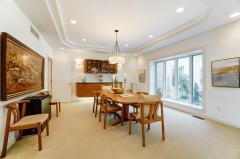 Formal Dining Room with tray ceilings, recessed lighting, Built ins
