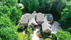New price! Glamorous custom built transitional! Original owners! Aprox 11,731 sq ft of luxury! Immaculate 3 levels! Indoor gunite pool-heated! Tennis court w/ gazebo! Granite, Taun hardwood, and wool carpeting flooring! Kinsella built-in cabinetry! Remodeled chef's kitchen w/ high-end appliances! Front/back/spiral staircases! Paver patios! Immediate occupancy Architecture by Larry Norris, Built by Arthur Brand with Interior Designer David Millett managing everything from the unique ceiling detail in every room to the Kinsella custom cabinetry!