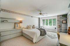 2nd floor rear center bedroom with closets & storage galore. Walkout to balcony!