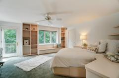 2nd floor right center bedroom with 2 closets, built ins & storage galore. Walkout to balcony! Full bath adjoins with skylite!