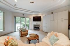 Exquisite Lower Level Living!!!! Fireplace! View of tennis courts! Walkout to sizable patio! Storage! View of pool!