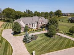 Custom built 5 bedroom / 5+2 bath upper echelon home in exclusive Riverview Estates of Coldstream. Exceptional craftsmanship and detailed finishes throughout including artisan granite and marble and signature lighting. Gorgeously appointed formal areas. Luxury 1st floor master suite with spa bath. Solid wood study with stone fireplace. Gourmet kitchen with custom hand-made flush-fit wood cabinets and commercial grade Thermador appliances, open to hearth room with stone fireplace and custom built-ins. Spectacular finished lower level with exquisite wet bar, media room with stone fireplace and custom temperature and humidity controlled 1,500+ bottle octagonal wine cellar. Attached side-entry 4-car garage. Stamped concrete circle drive. Meticulously maintained with extensive improvements and upgrades throughout. A true natural beauty majestically sited on a handsomely landscaped 1.33 acre lot.