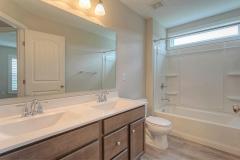 Upstairs hall bath with double vanity.