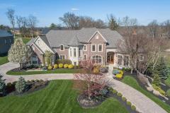Custom built 5 bedroom / 5+2 bath upper echelon home in exclusive Riverview Estates of Coldstream. Exceptional craftsmanship and detailed finishes throughout including artisan granite and marble and signature lighting. Gorgeously appointed formal areas. Luxury 1st floor master suite with spa bath. Solid wood study with stone fireplace. Gourmet kitchen with custom hand-made flush-fit wood cabinets and commercial grade Thermador appliances, open to hearth room with stone fireplace and custom built-ins. Spectacular finished lower level with exquisite wet bar, media room with stone fireplace and custom temperature and humidity controlled 1,500+ bottle octagonal wine cellar. Attached side-entry 4-car garage. Stamped concrete circle drive. Meticulously maintained with extensive improvements and upgrades throughout. A true natural beauty majestically sited on a handsomely landscaped 1.33 acre lot.