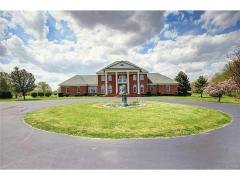 Main house located at 475 New Burlington. The gated entrance leads first to the main house where a beautiful picturesque fountain greets you.