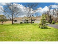 This maintenance free ranch is located on Property #3 at 437 New Burlington Road and has peaceful quiet views of woods.