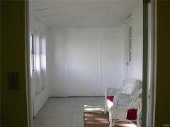 Enclosed back porch. Ventless propane heater from laundry room may provide more heat in cooler weather.
