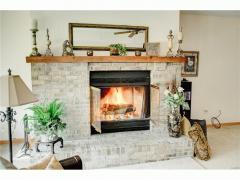 Enjoy your own roaring fire in the lower lever with this real wood fireplace.