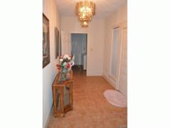West wing entry with laundry & garage door in background