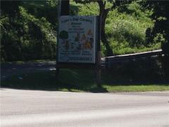 This sign is on the corner of Rt. 52 and Scoffield Rd. which turns to the left off Rt 52 going east.
