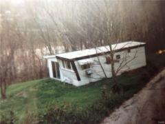 A day in the sunshine on the river. This mobile home is still there, it needs some work.