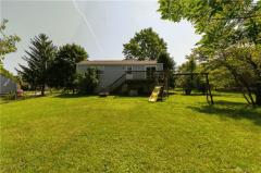 spacious fenced rear yard - deck off dining area