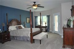Large master has walk out to patio and sitting area.