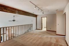 Loft area with wood beam