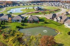 9376 Chaumont Avenue, showing back of home, backs up to pond view and green space! ( it is the one with the red burning bush in back yard..