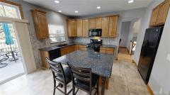 Large island is great for entertaining. Cabinets are prewired for speakers above.