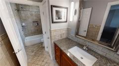 Impressively updated Master bathroom.