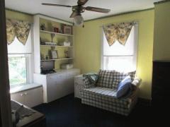 This bedroom is used as a sitting room for reading and relaxing.