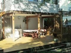 Have grill outs and play yard games in this wooded backyard.