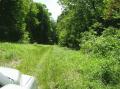 Driveway across from neighbors barn is the end of property.