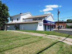 Seller owns 3 adjoining properties to this building and will give the buyer first right of purchase. 2 bedroom, 1 bath apartment, Owner pays gas, electric, water, and sanitation.