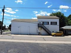 The second floor apartment is very large with aprox. 950 SF. and currently generates $650 a month in rental income, the utilities are paid by the tenant and on a separate meter. It features a full size kitchen with tile and plenty of storage space.