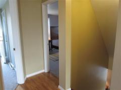 Upper level hallway and stairwell to main level (secondary building).
