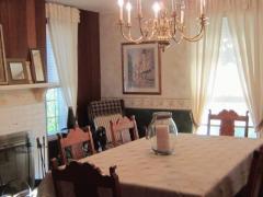 f=Formal dining room with fireplace.