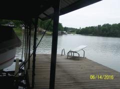 Swimming side of dock with dive board and ladder