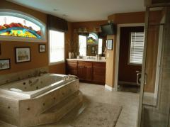 Enjoy the whirlpool or 4 X 4 shower with multiple heads/hoses. Two large walk-in closets and his and her vanities