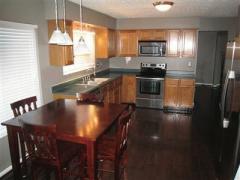 Kitchen and breakfast are feature wood flooring, and stainless appliances