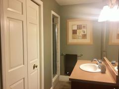 Check out this Guest Bath! Linen Closet, Tiled walk in closet and flooring!