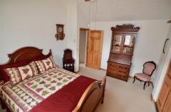Offers a warm decor* Features beautiful carpeting, natural woodwork/doors, ceiling fan & just the right size for a 2nd Bedroom!