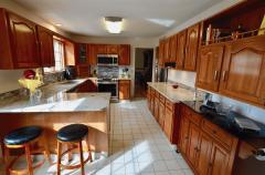 Great setup for the Chef in the household....Lots of counter space & everything at your fingertips! Features All SS Appliances, Gorgeous countertops, Newer fixtures, Counter Bar & awesome outside scenery!