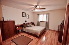 Bright & Open Master BR on 1st Floor! Features Hickory HDWD floors, Natural woodwork/doors & Adjoining Master Bath. Private from the other Bedrooms & So convenient.....No Steps!