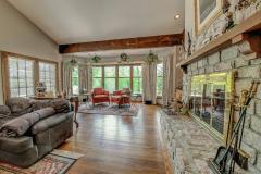 The Great Room with stone gas fire place and hardwood floors.