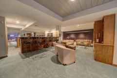 The lower level was made for entertaining with its wet bar, built-in refrigerator, dishwasher and kitchen aid cooktop, custom made bookshelves and TV built-in. The lower level has a large entertainment area with full bathroom.